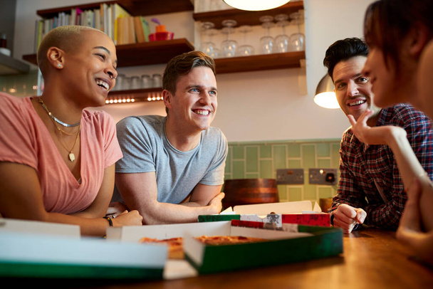 Group Of Gay Friends Meeting At Home And Eating Takeaway Pizza - Photo, image