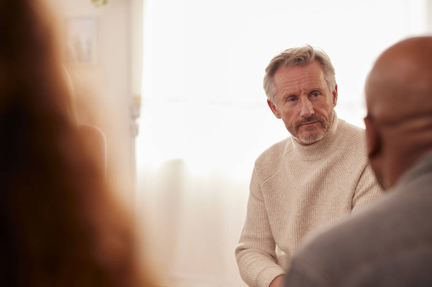 Mature Man Attending Support Group Meeting For Mental Health Or Dependency Issues In Community Space - Foto, immagini