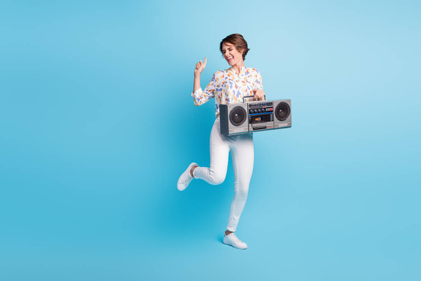 Full size photo of young attractive girl excited crazy dance party hold retro boombox isolated over blue color background - Φωτογραφία, εικόνα