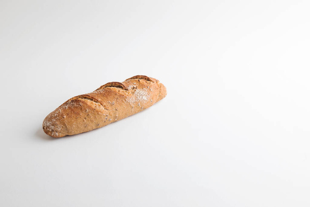 Unleavened chrono bread with seeds on a white background - Valokuva, kuva