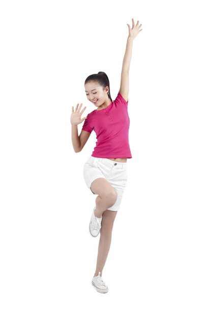 Portrait of a Young woman dancing and smiling - 写真・画像