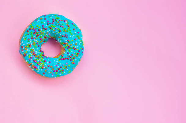 blue donat on a pink background - Photo, image