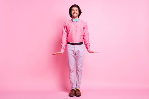 Full size photo of happy positive young gentleman beaming smile shy isolated on pastel pink color background - Foto, afbeelding