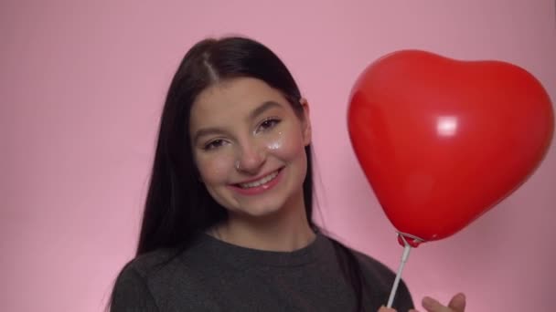 Happy woman with red heart balloon, st. Valentines Day celebration. - Imágenes, Vídeo