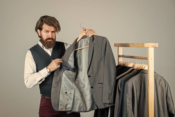 Working on new collection. formal and office wardrobe. businessman. confident tailor designing male jacket. handsome sartor with tape measure. male beauty and fashion. bearded man tailoring clothes - Foto, immagini