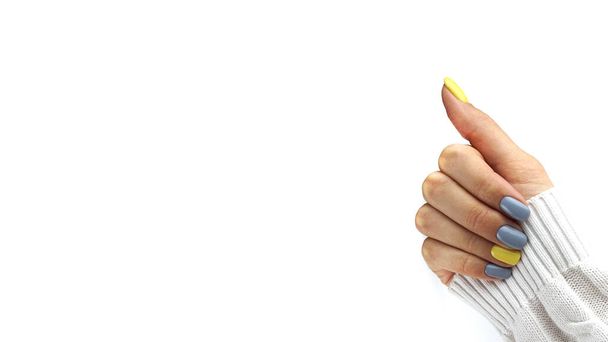 Women hands with Yellow and gray manicure. Trendy colours. - Φωτογραφία, εικόνα