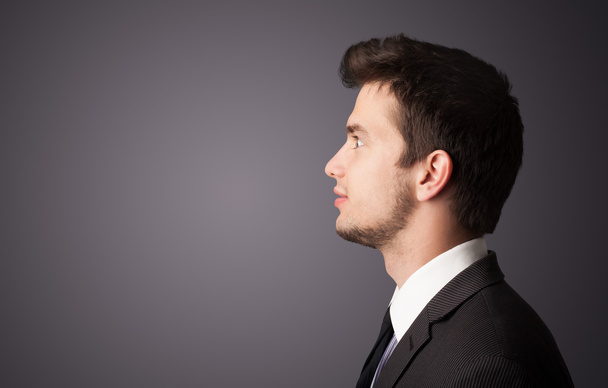 Young businessman thinking with copyspace - 写真・画像