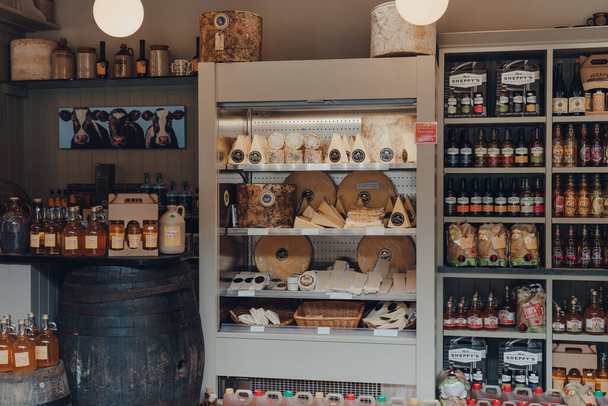 Cheddar, UK - July 26, 2020: Local cheese an products inside The Original Cheddar Cheese Co shop in Cheddar, a village famous for its Gorge and is the birthplace of world famous cheese. - 写真・画像