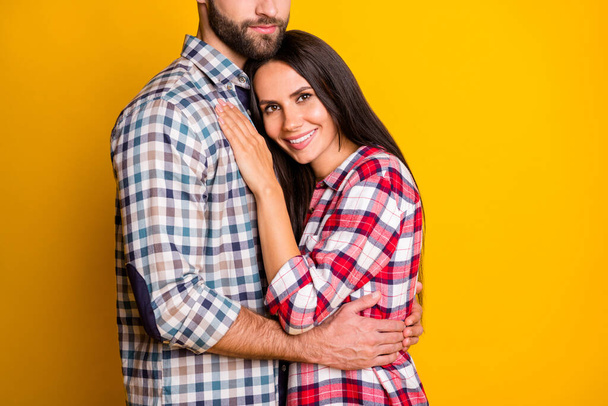 Photo portrait of girl laying on mans chest hugging isolated on vivid yellow colored background - Foto, imagen