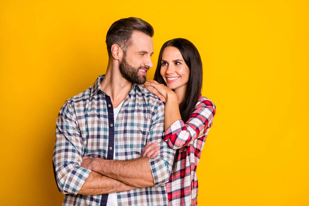 Portrait of attractive cheerful sweet affectionate couple folded arms embracing isolated over bright yellow color background - Valokuva, kuva