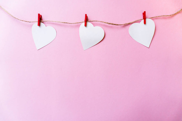 white paper hearts hanging on the clothesline. Greeting card wit - Photo, Image