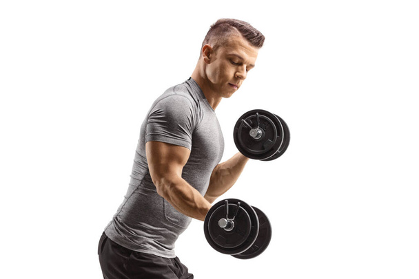 Man lifting dumbbells isolated on white background - Photo, image