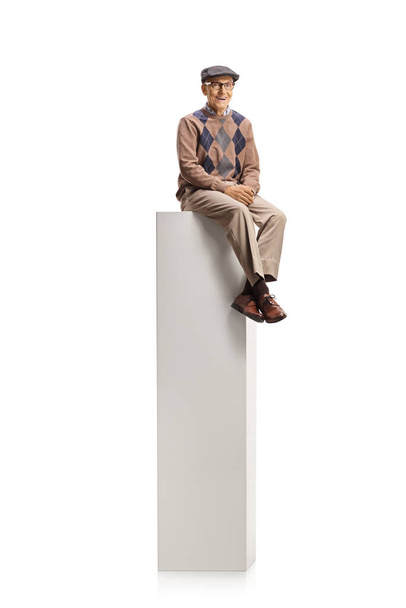 Male pensioner sitting on a column isolated on white background - Fotografie, Obrázek