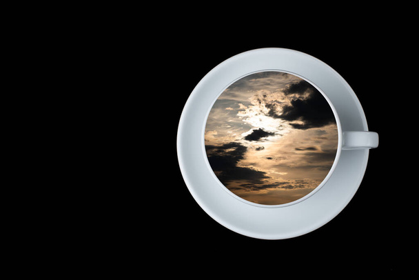 sunset in the sky reflected in a white coffee cup on a black background. copy space. - Zdjęcie, obraz
