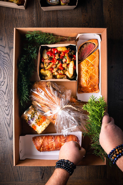Healthy food delivery. Take away vegetables, meat in boxes. Top view, flat lay with copy space. delivery of ready-made food in boxes for festive table top view - Photo, Image