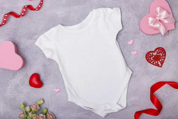 Childrens clothing mock up flat lay with decor for the Valentines Day for logos and texts - Photo, Image