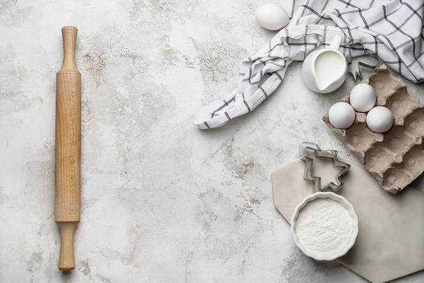 Ingredients for dough and rolling pin on light background - Photo, Image