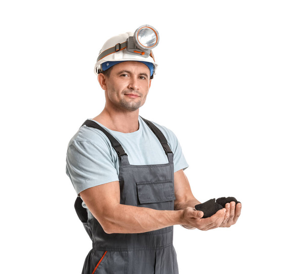 Miner man with coal on white background - Foto, afbeelding