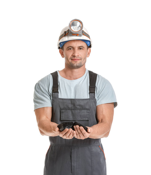 Miner man with coal on white background - Zdjęcie, obraz