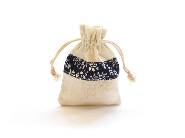 Empty small cotton bag with string on white background. Burlap sack. - Photo, Image
