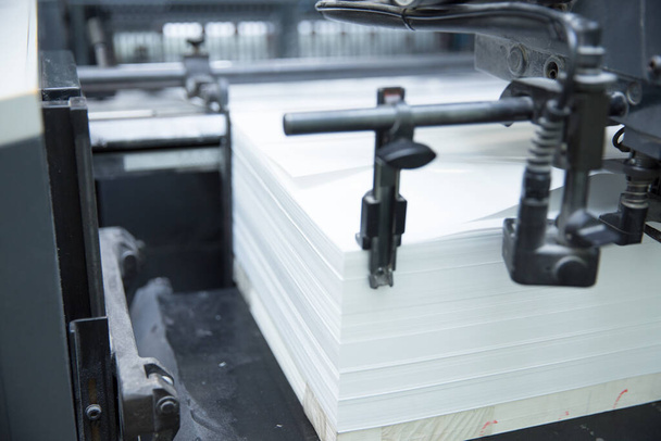Stack of paper in a printing press. - Fotoğraf, Görsel