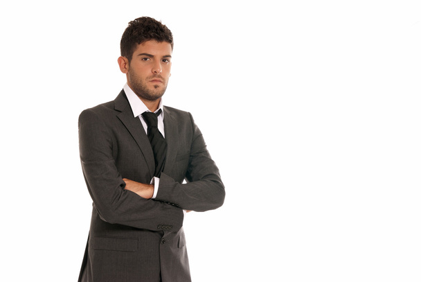 Young businessman with copy-space looking serious arms crossed isolated on - Photo, Image