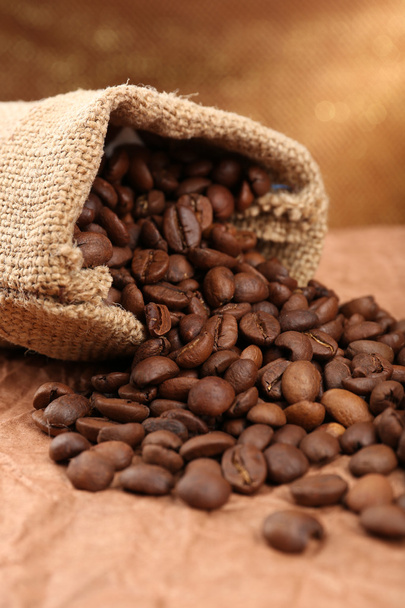 Coffee beans in sack on table close-up - Valokuva, kuva