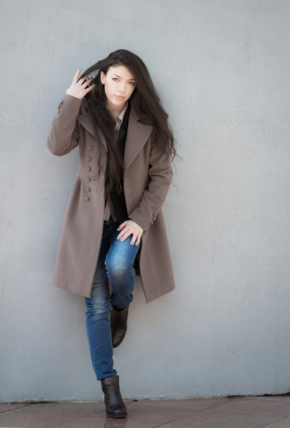 Young girl in coat. - Fotoğraf, Görsel