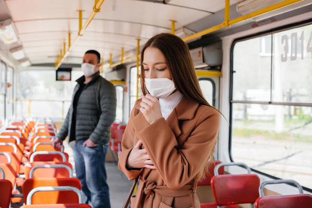 Passengers on public transport during the coronavirus pandemic keep their distance from each other. Protection and prevention covid 19 - 写真・画像