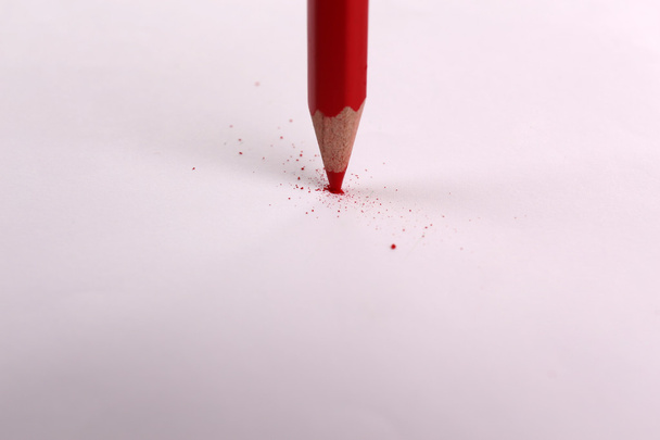 Breaking pencil on paper, close up - Zdjęcie, obraz