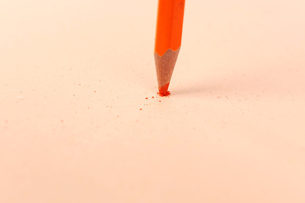 Breaking pencil on paper, close up - Foto, Bild