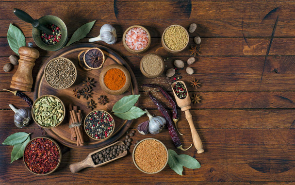 Set of various aromatic spices and herbs on wooden background with copy space for your recipe, flat lay, rustic style. - Foto, imagen