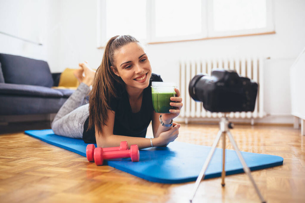 woman making video blog about healthy living from her home - Fotoğraf, Görsel