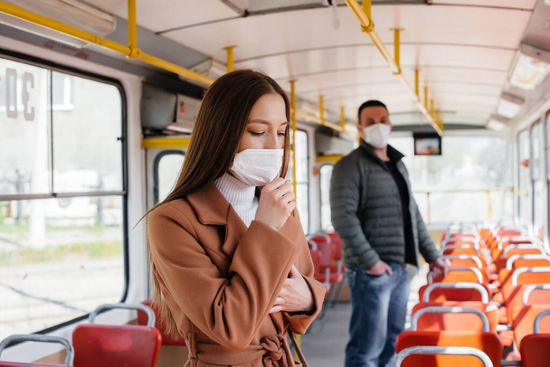 Passengers on public transport during the coronavirus pandemic keep their distance from each other. Protection and prevention covid 19 - Φωτογραφία, εικόνα