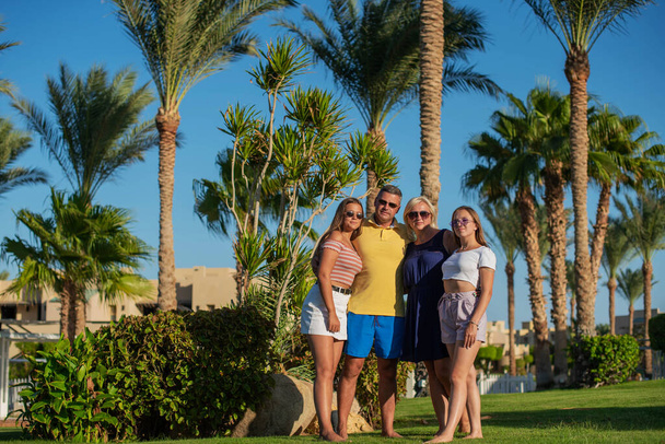 Real people concept, beautiful family, two teenage girls, mother and father happiness and nice body for enjoyed people live an lifestyle, smile and walk together in vacation. - Photo, Image