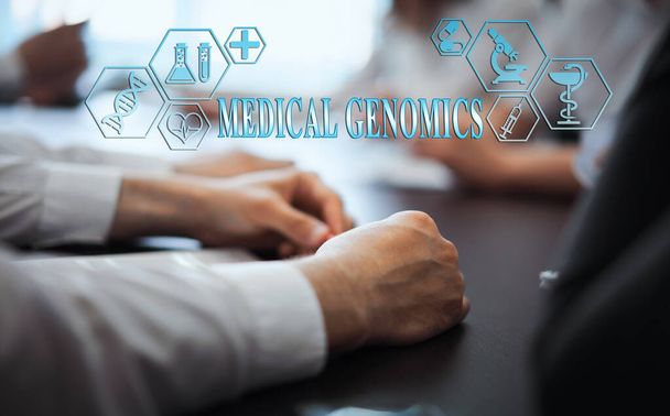 A group of doctors in a modern clinic is planned. The concept of modern medicine and medical biotenology. Medical icons on the screen with the inscription: MEDICAL GENOMICS - Foto, Imagen