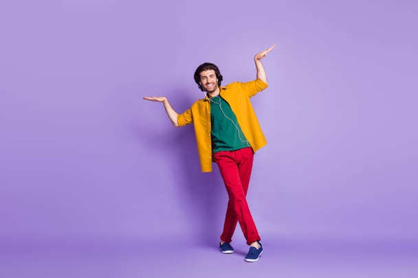 Photo portrait full body view of man doing egyptian dance isolated on vivid purple colored background - Fotoğraf, Görsel