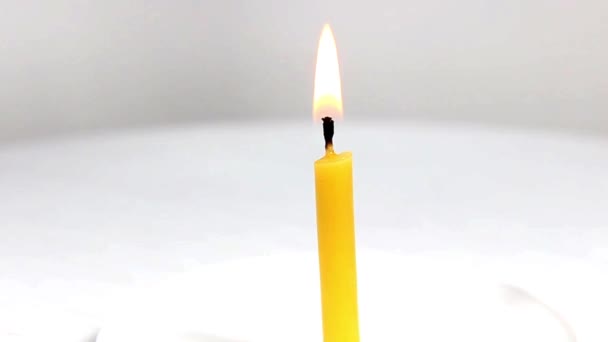 Church burning candle on a white background. Turntable. Close-up. - Footage, Video