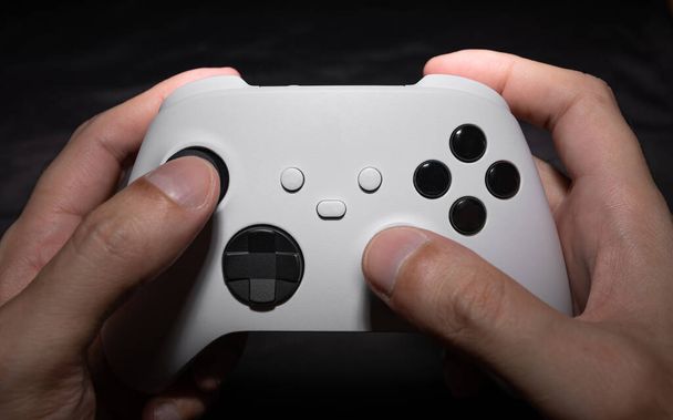 Next Generation game controller on man hands - Photo, Image