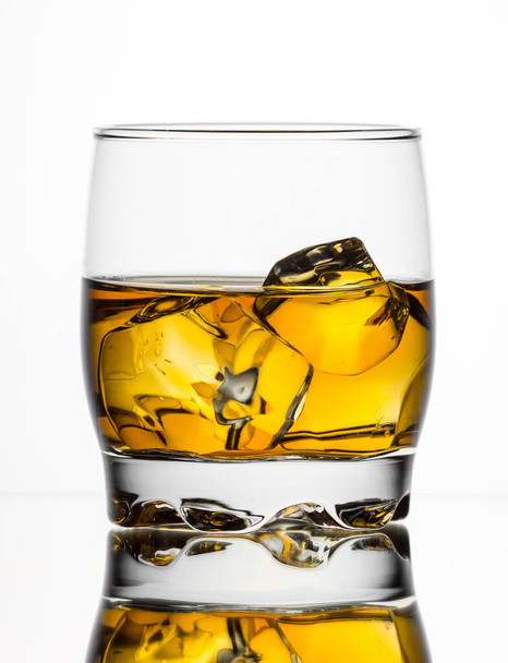Whisky on the rocks on white background - Foto, afbeelding