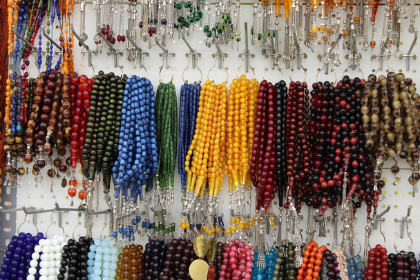 Rosaries hanging on a thread. Prayer beads on a thread. - Photo, Image