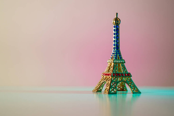 Colorful Eiffel tower on a lighted surface  - Фото, зображення