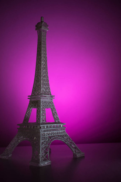 Colorful Eiffel tower on a lighted surface  - Photo, Image