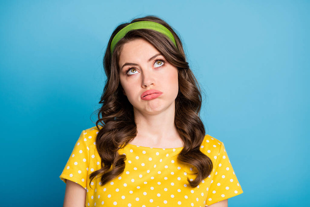 Photo of frustrated tired girl rolling eyes look copyspace sighing isolated over blue color background - Fotoğraf, Görsel