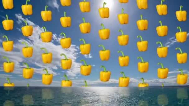 Gele paprika 's vallen tegen zee en lucht - Video