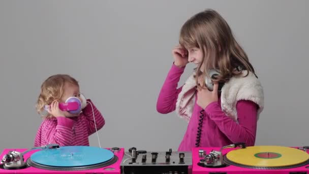 Two girls playing with record players - Footage, Video