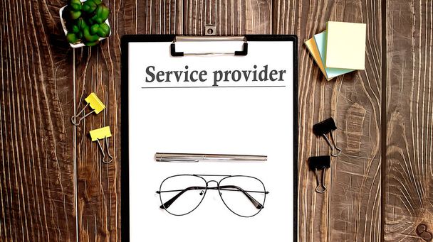 SERVICE PROVIDER Text written on paper on wooden background - Photo, Image