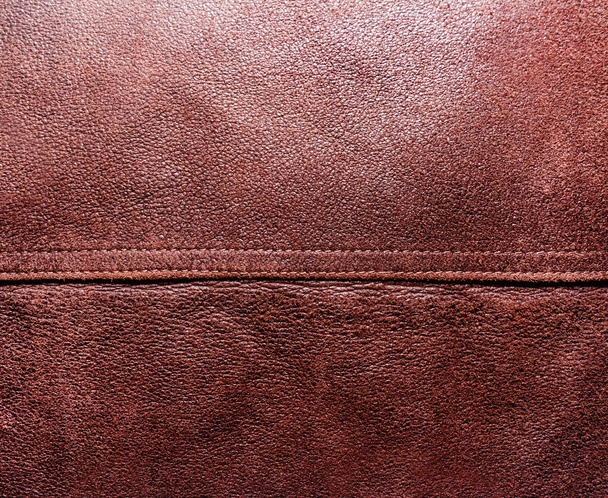 Foto de fondo de textura de gamuza marrón con costura. - Foto, imagen