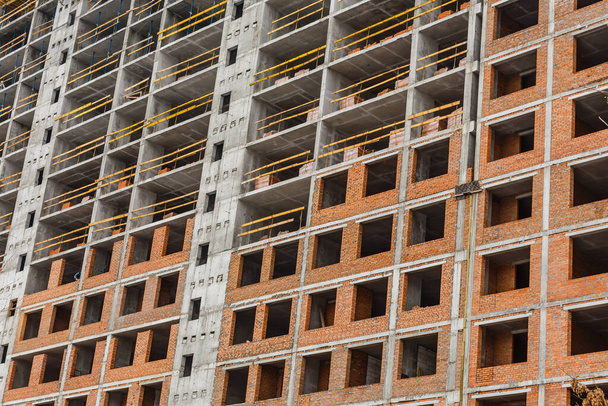 scaffolding on a building wall. building getting a new paint. - Photo, Image