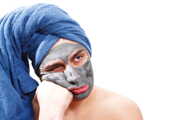 man is waiting for the mask to dry on the skin, funny, man like a girl, isolated photo, - Foto, imagen